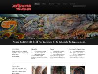 Art in Motion Tattoo and Piercing Art in Motion Tattoo and Piercing