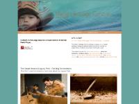 haidaheritagecentre.com Six Totem Poles at Kaay Llnagaay, Loo Taas - Haida Canoe, Totem Pole in Skidegate