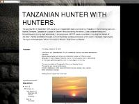 TANZANIAN HUNTER WITH HUNTERS.
